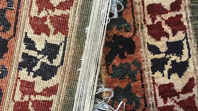Rug in the process of being repaired and restored
