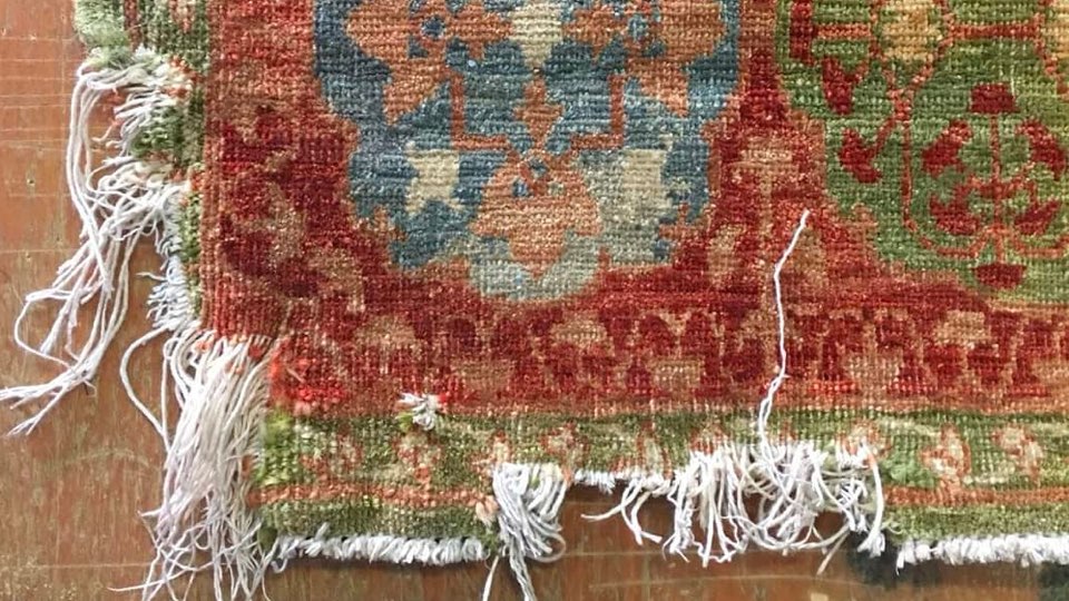 Hand-knotted Mamluk design rug corner chewed by a dog